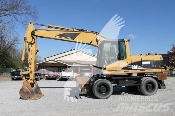 CAT M318C Gumikerekes kotrók
