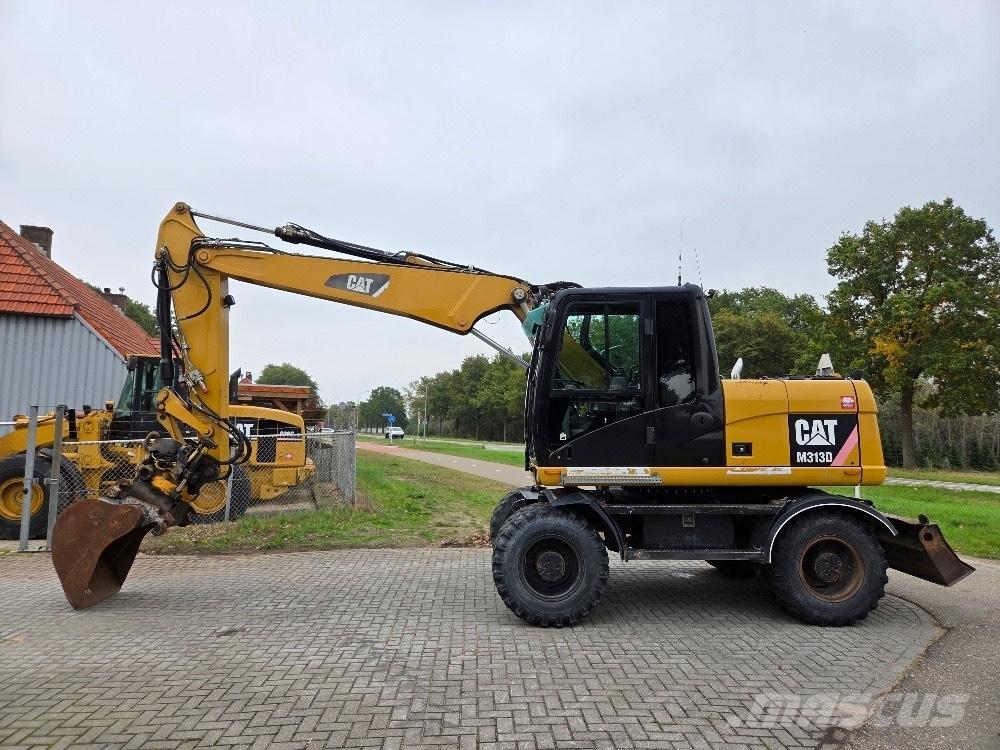 CAT M313D Gumikerekes kotrók