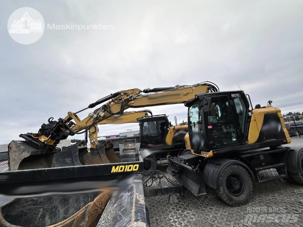 CAT M 315 Gumikerekes kotrók