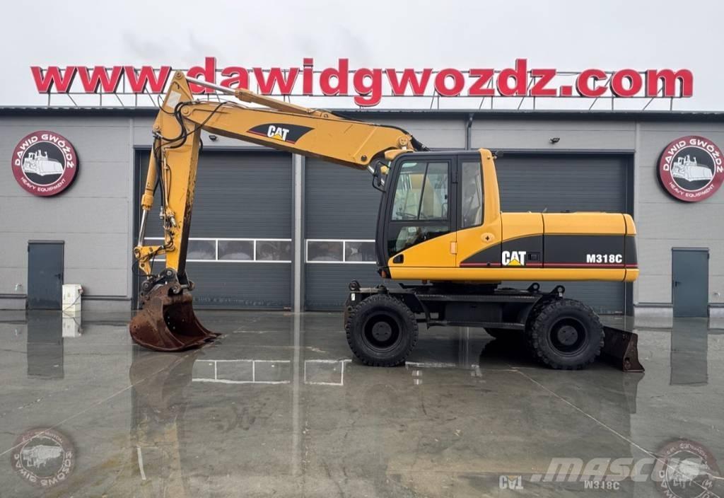 CAT M 318 C Gumikerekes kotrók