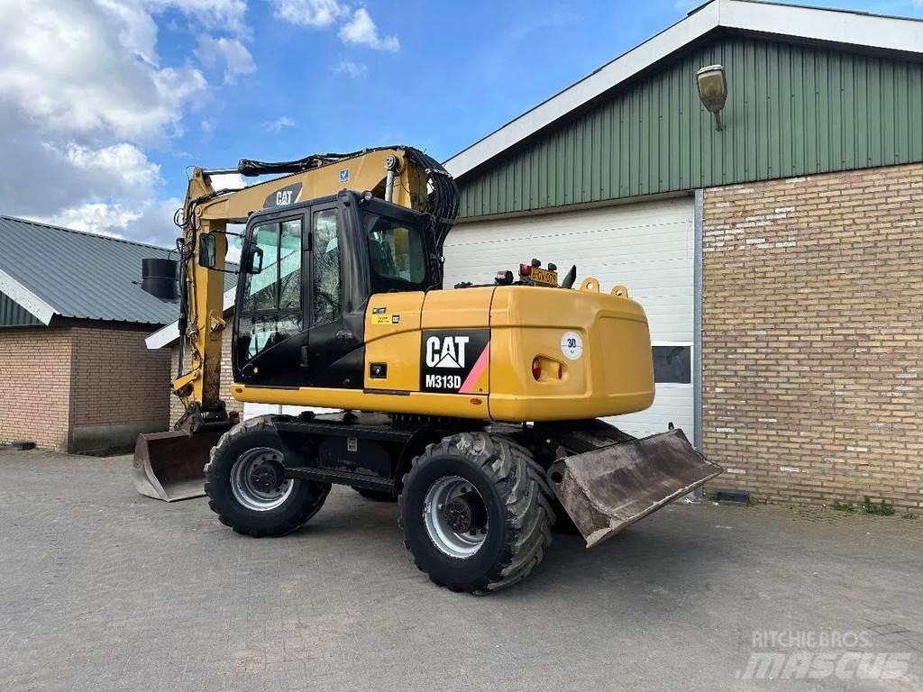 CAT M313D Gumikerekes kotrók