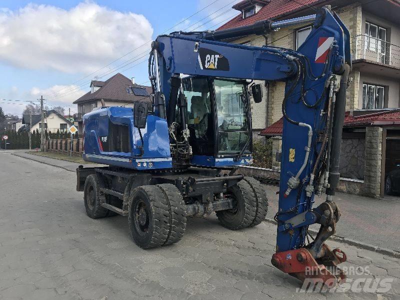 CAT M318f 318 f Gumikerekes kotrók