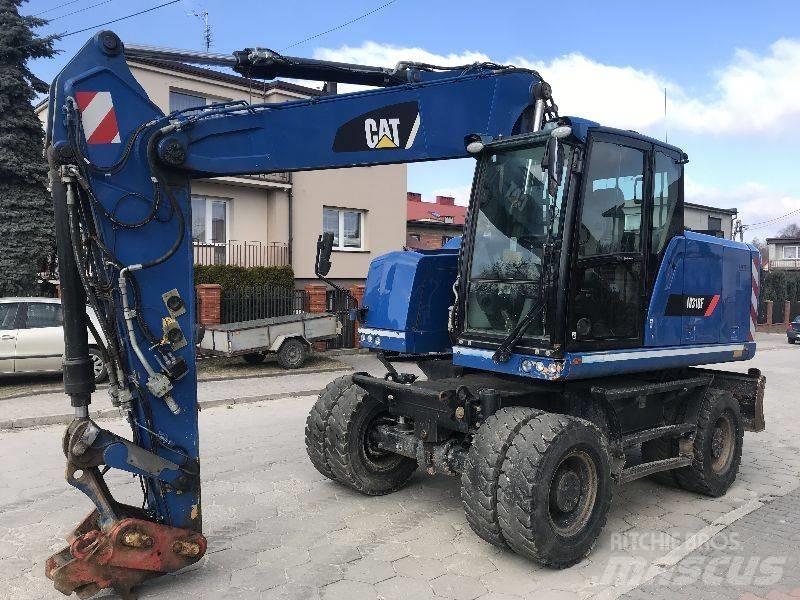 CAT M318f 318 f Gumikerekes kotrók