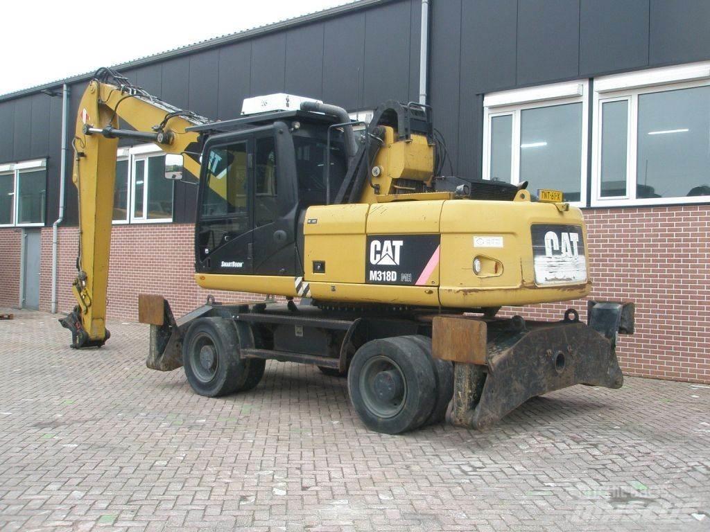 CAT M318D Gumikerekes kotrók