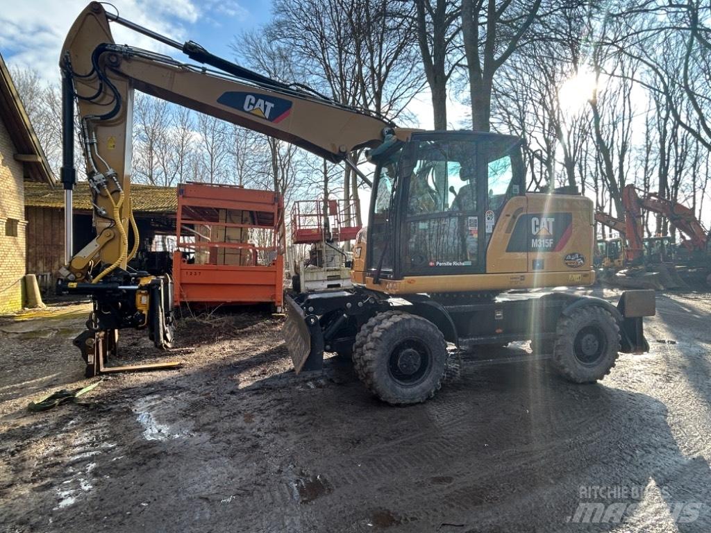 CAT M315 Gumikerekes kotrók