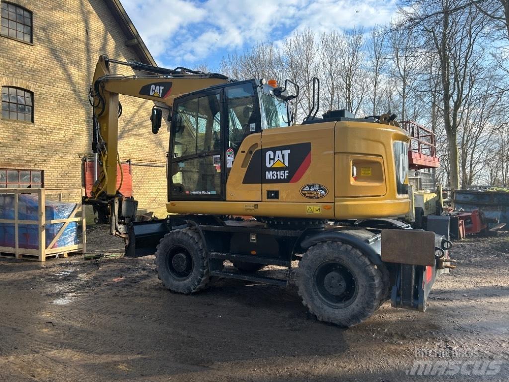 CAT M315 Gumikerekes kotrók