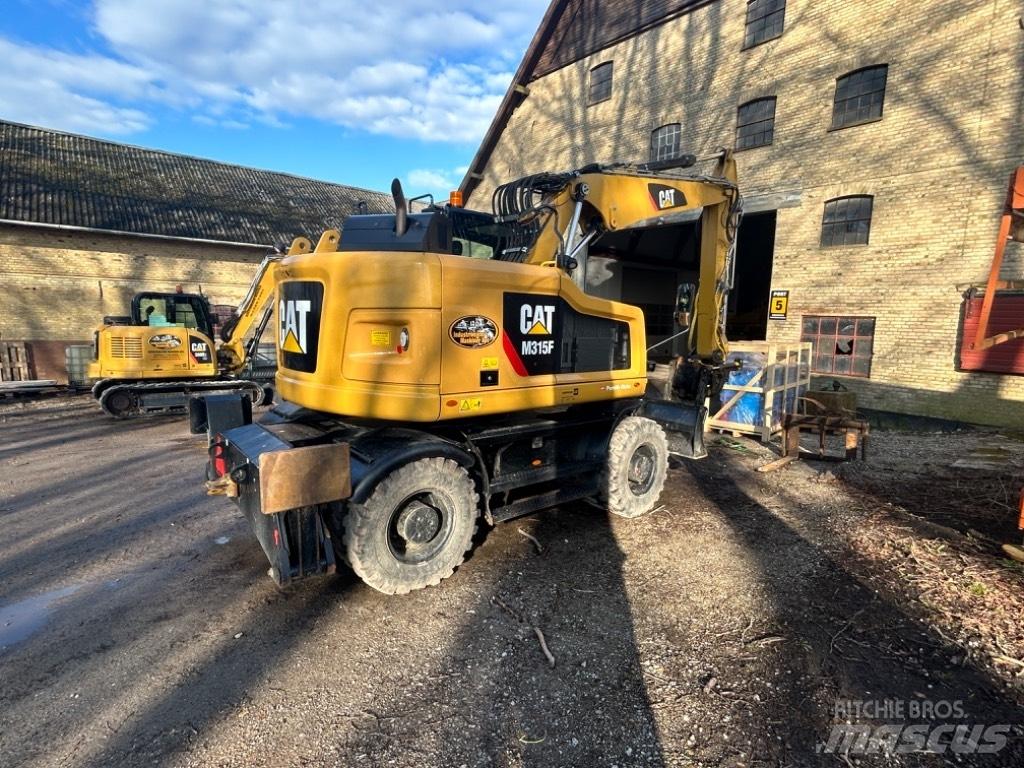 CAT M315 Gumikerekes kotrók