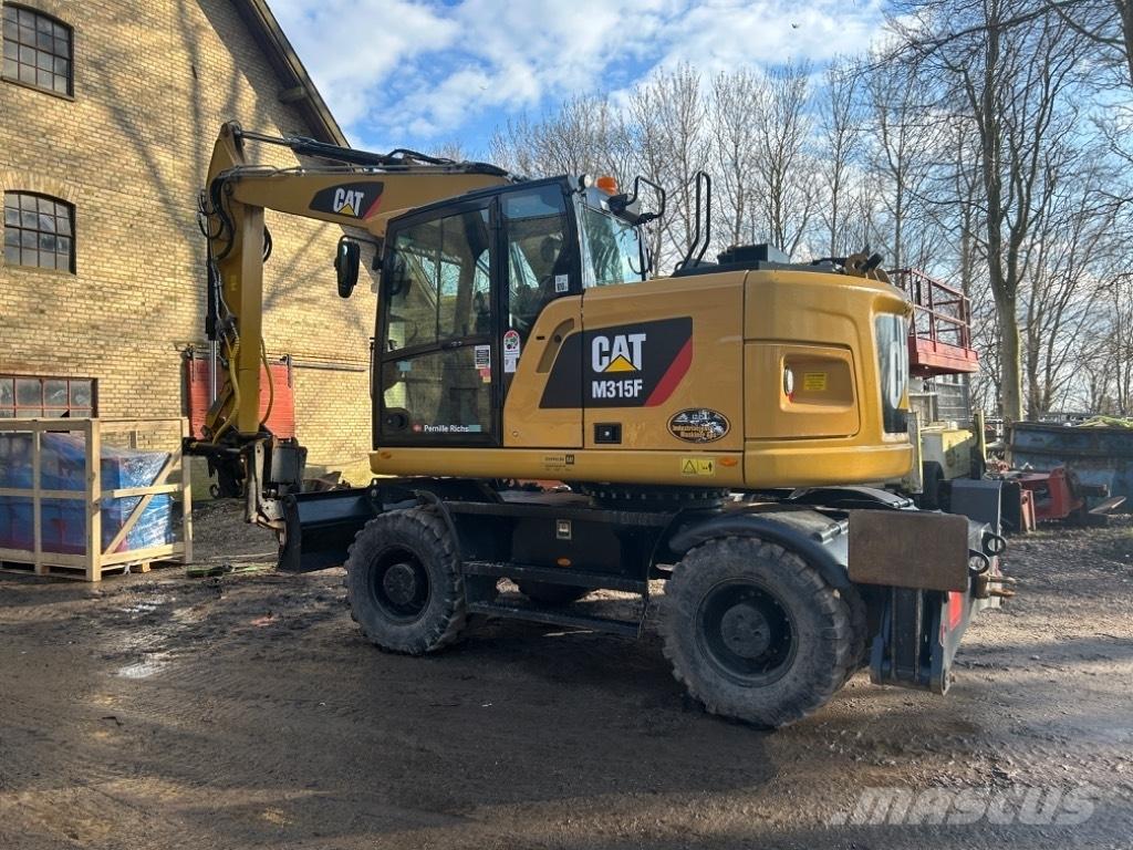 CAT M315F Gumikerekes kotrók