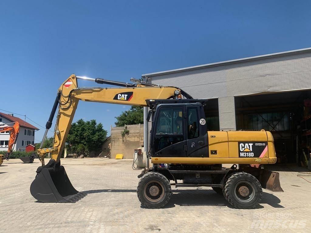 CAT M 318 D Gumikerekes kotrók