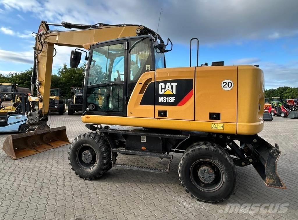 CAT M 318 F Gumikerekes kotrók