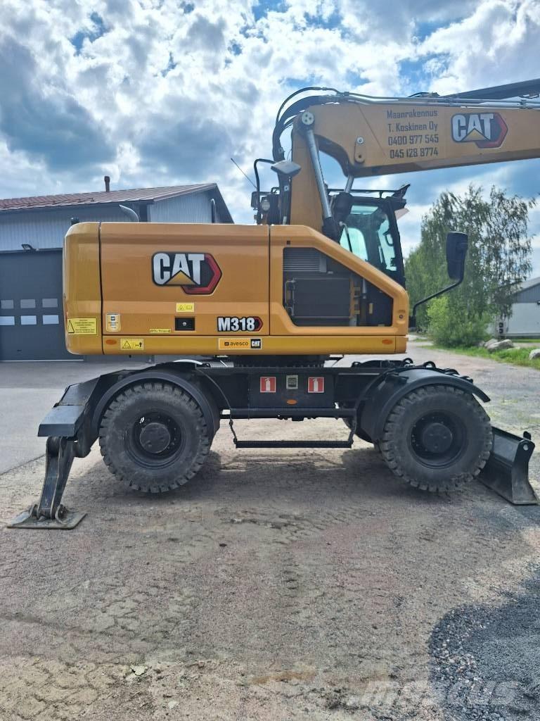 CAT M 318 Gumikerekes kotrók
