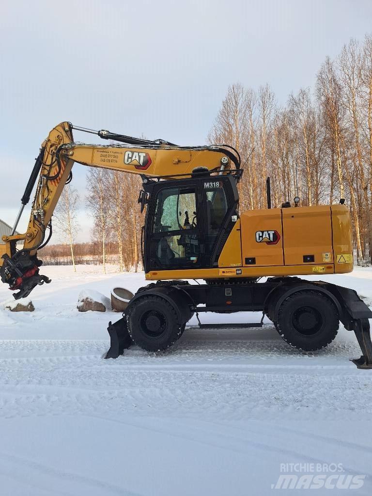 CAT M 318 Gumikerekes kotrók