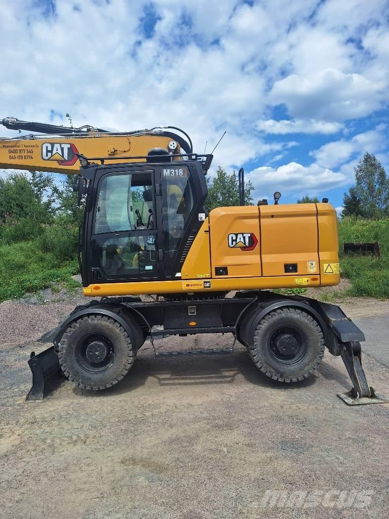 CAT M 318 Gumikerekes kotrók