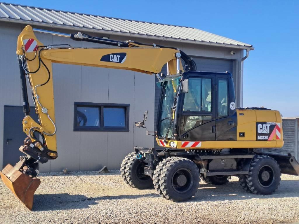 CAT M 313D Gumikerekes kotrók