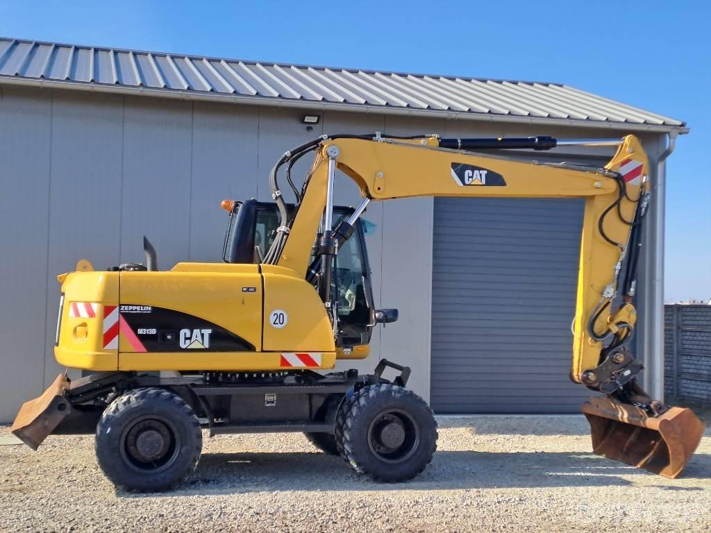CAT M 313D Gumikerekes kotrók