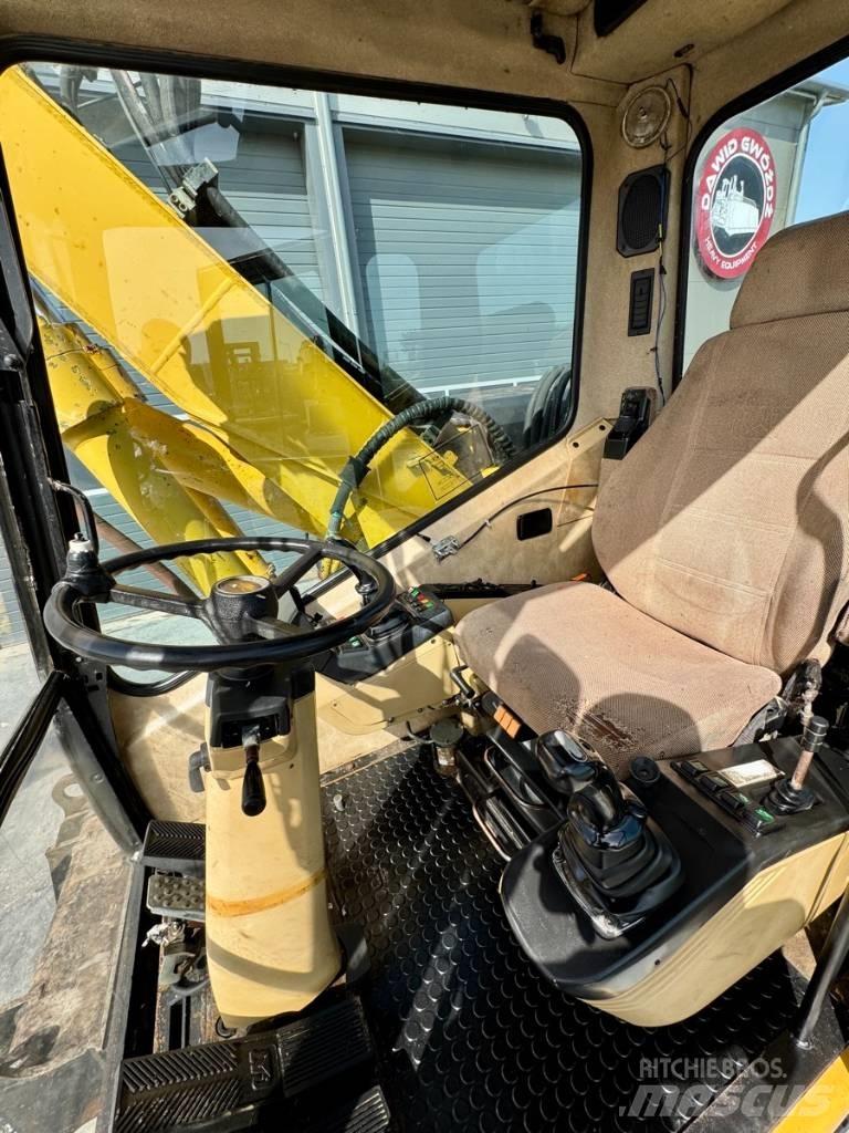 CAT M 312 Gumikerekes kotrók