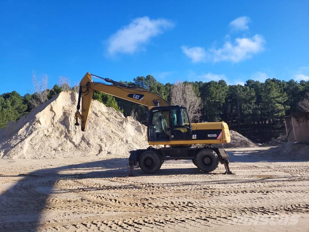 CAT 316d Gumikerekes kotrók