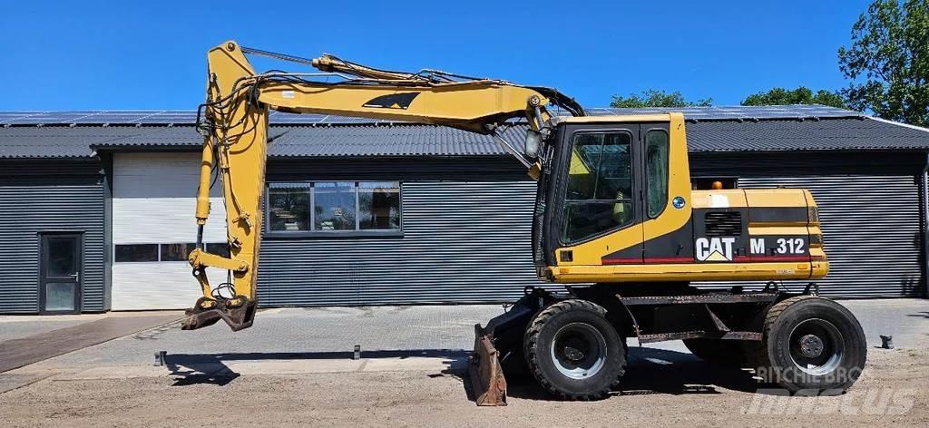 CAT M312 Gumikerekes kotrók