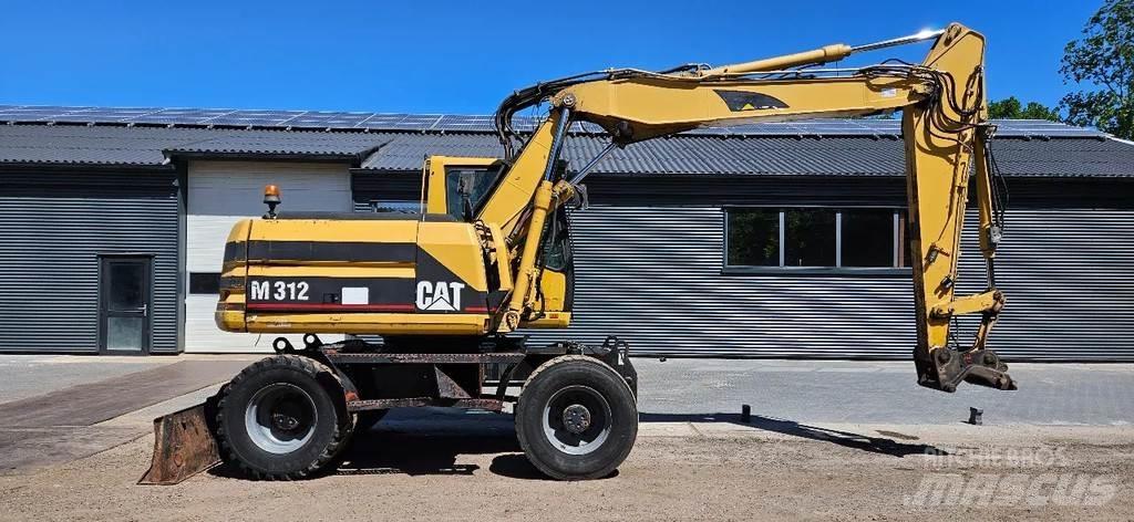 CAT M312 Gumikerekes kotrók