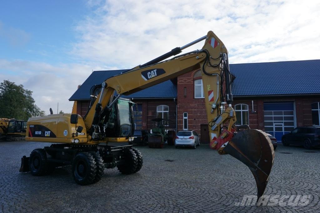 CAT M 318 D Gumikerekes kotrók