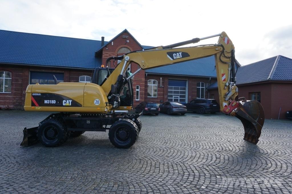CAT M 318 D Gumikerekes kotrók