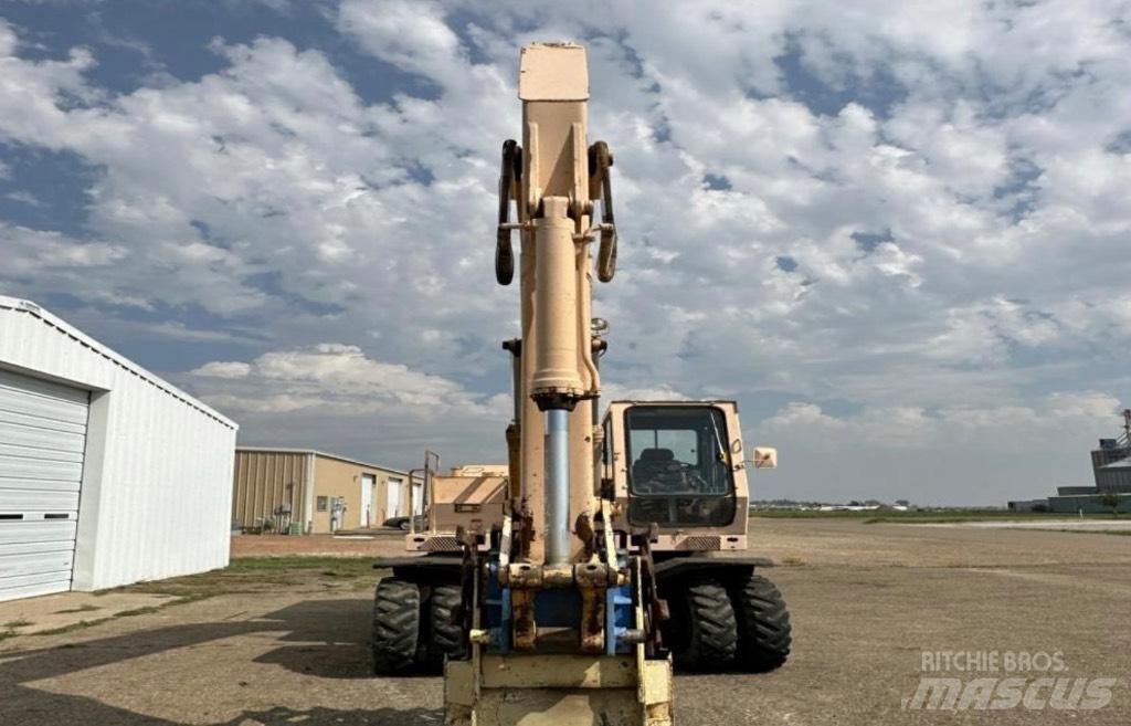 John Deere 595 Gumikerekes kotrók