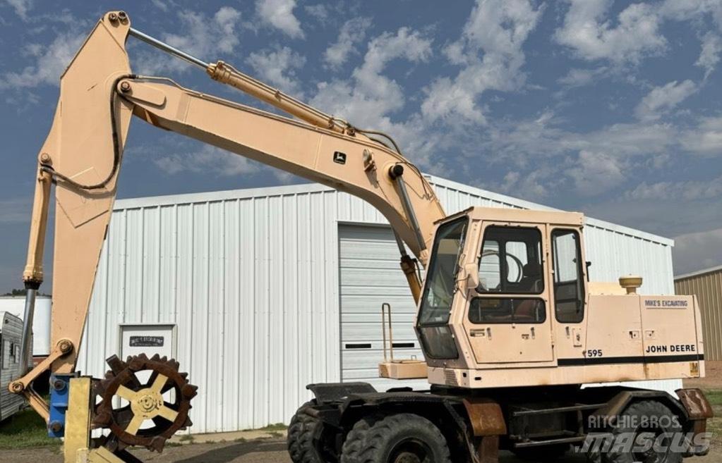 John Deere 595 Gumikerekes kotrók