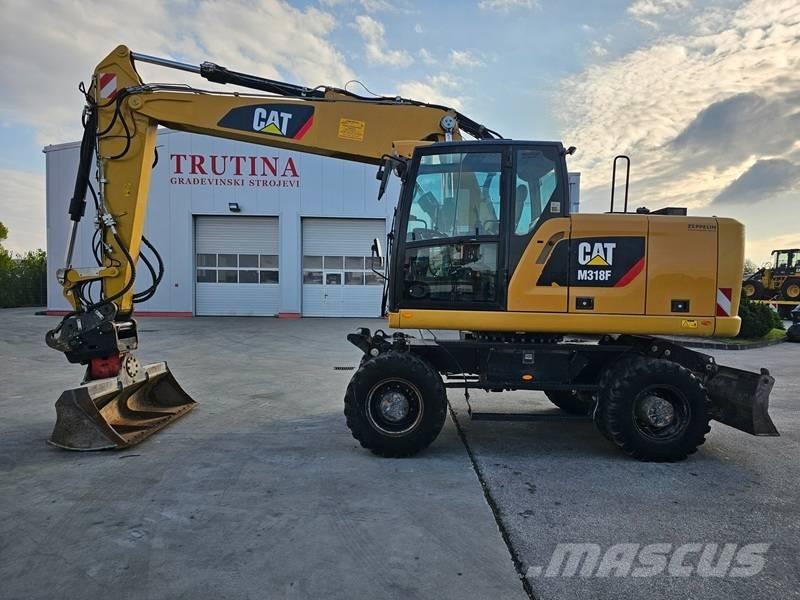 CAT M 318 F Gumikerekes kotrók