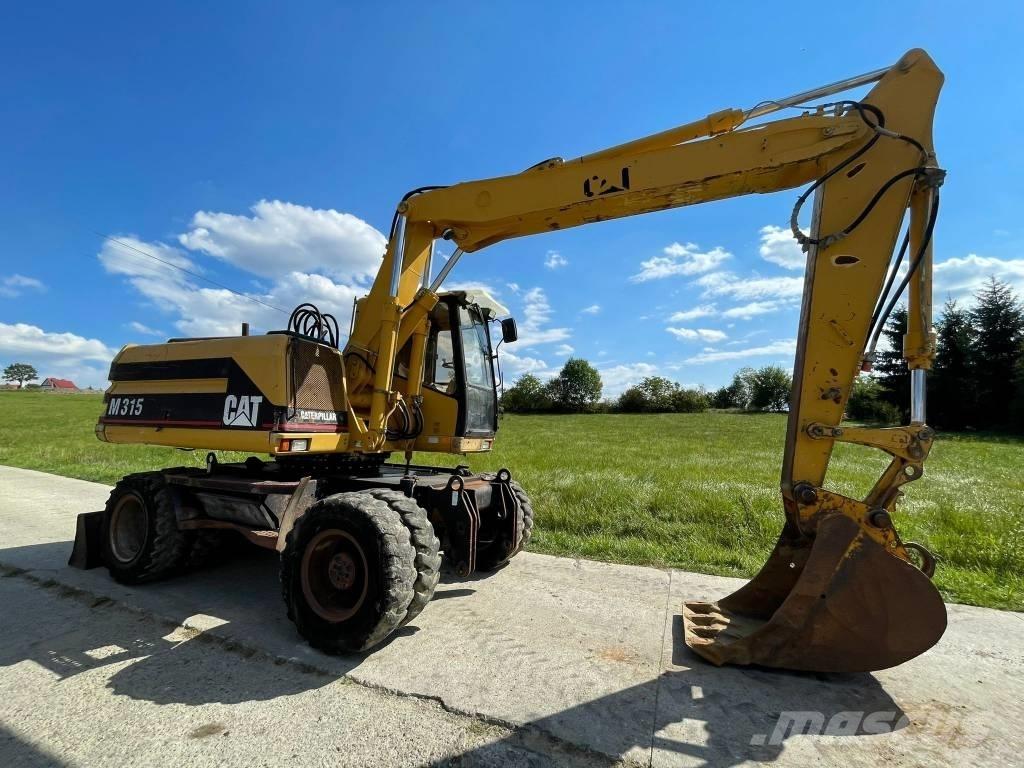 CAT M 315 Gumikerekes kotrók