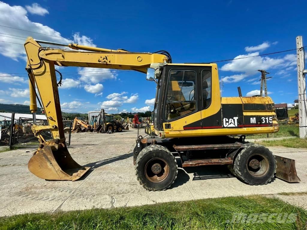 CAT M 315 Gumikerekes kotrók