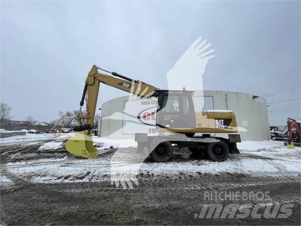 CAT M318D Gumikerekes kotrók