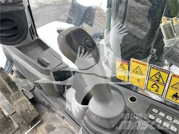 CAT M318D Gumikerekes kotrók