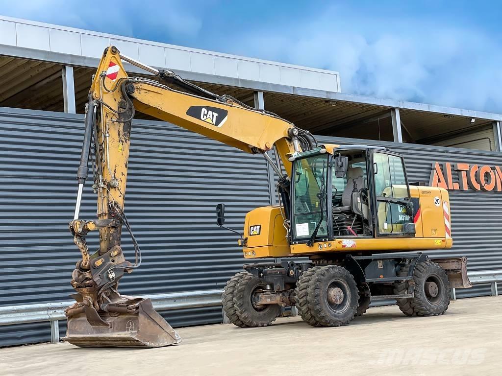 CAT M318F Gumikerekes kotrók