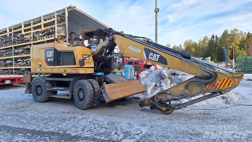CAT M314F Gumikerekes kotrók