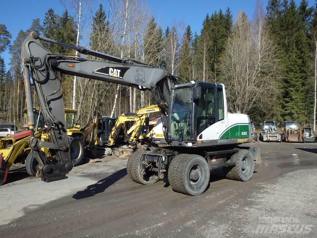 CAT M 313 C 4x4 Gumikerekes kotrók