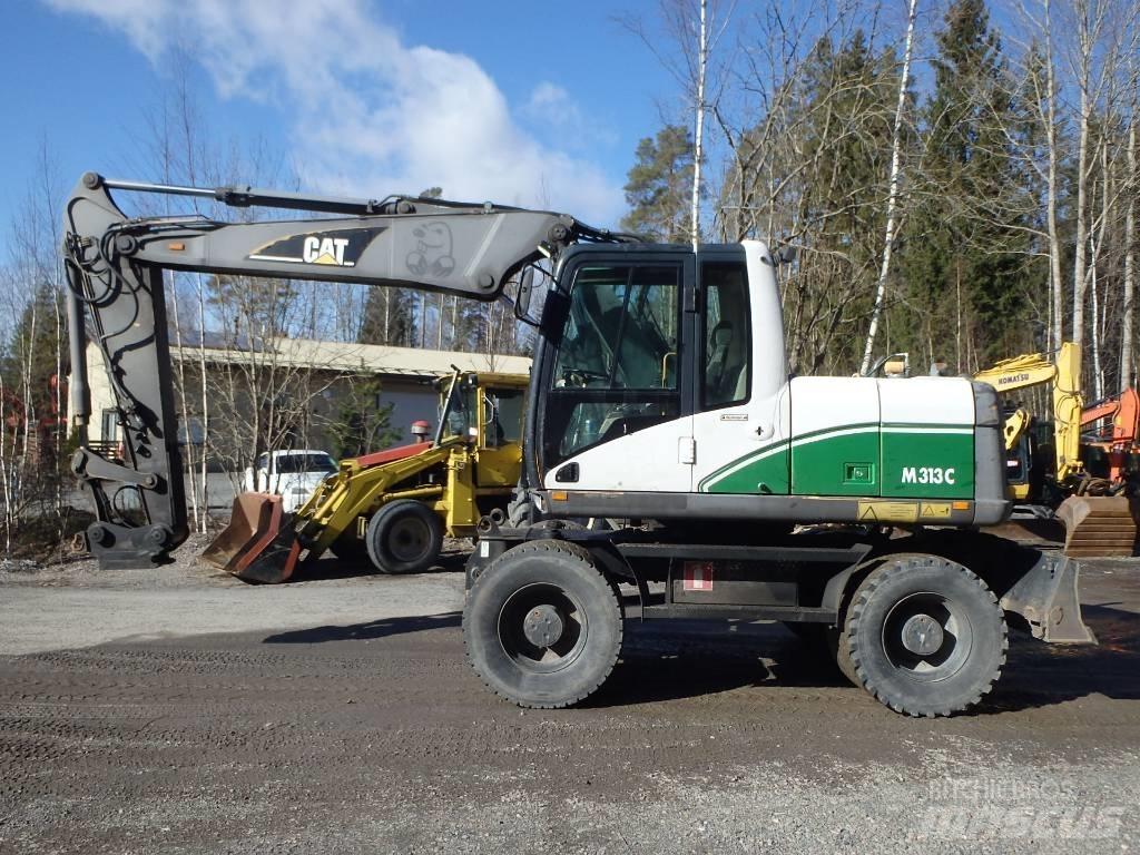 CAT M 313 C 4x4 Gumikerekes kotrók