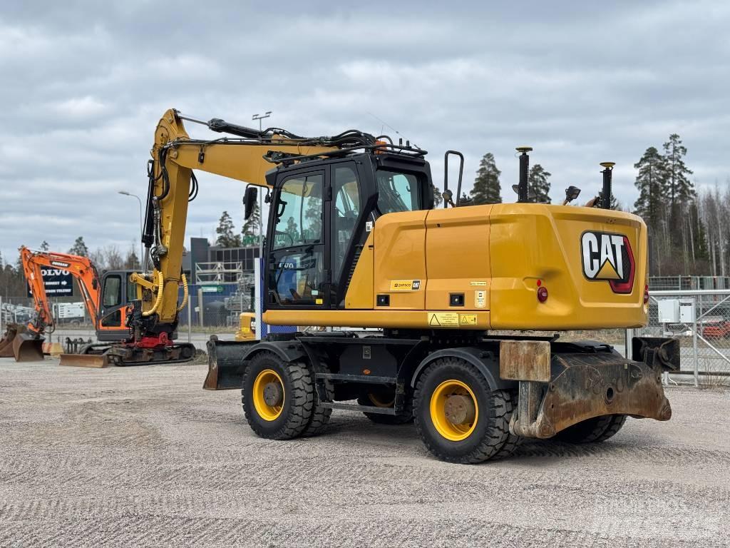 CAT M 318 Gumikerekes kotrók