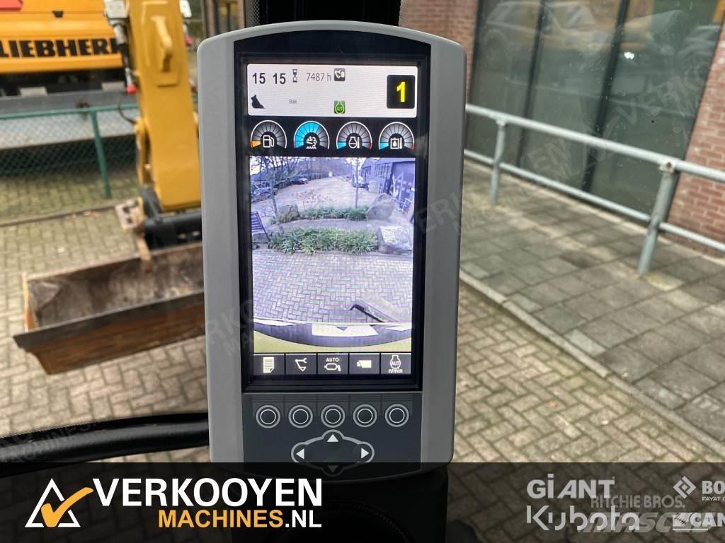 CAT M313D Gumikerekes kotrók