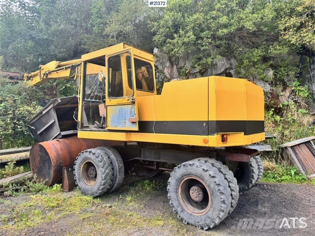 CAT 212B Gumikerekes kotrók