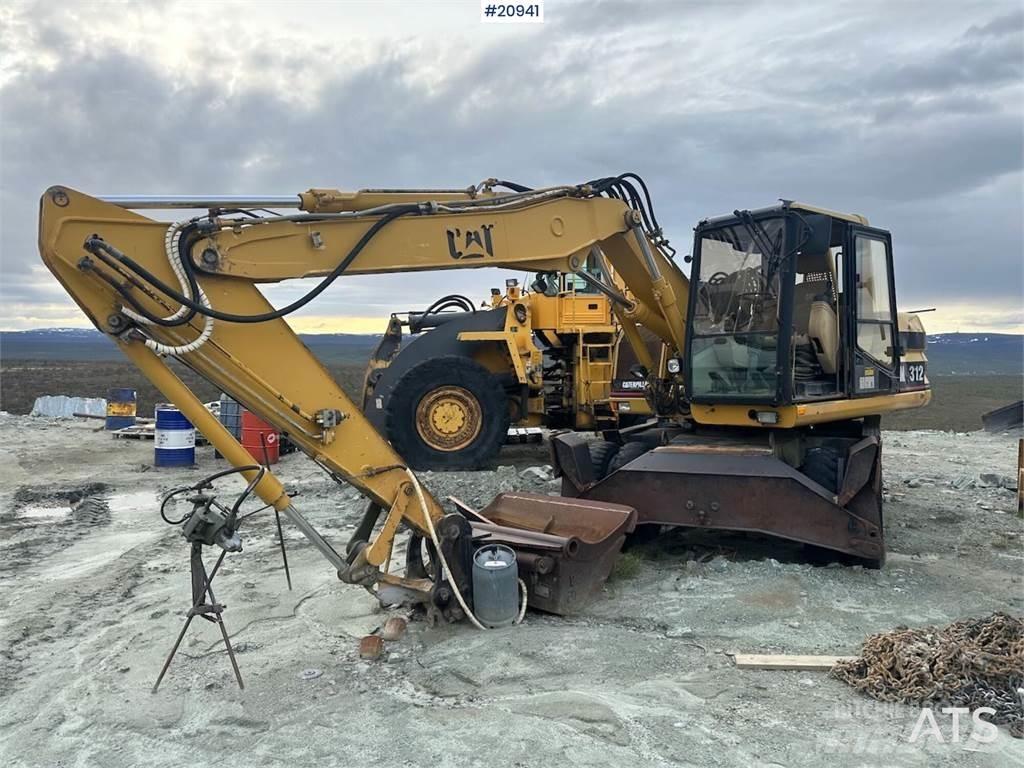 CAT 312 Gumikerekes kotrók