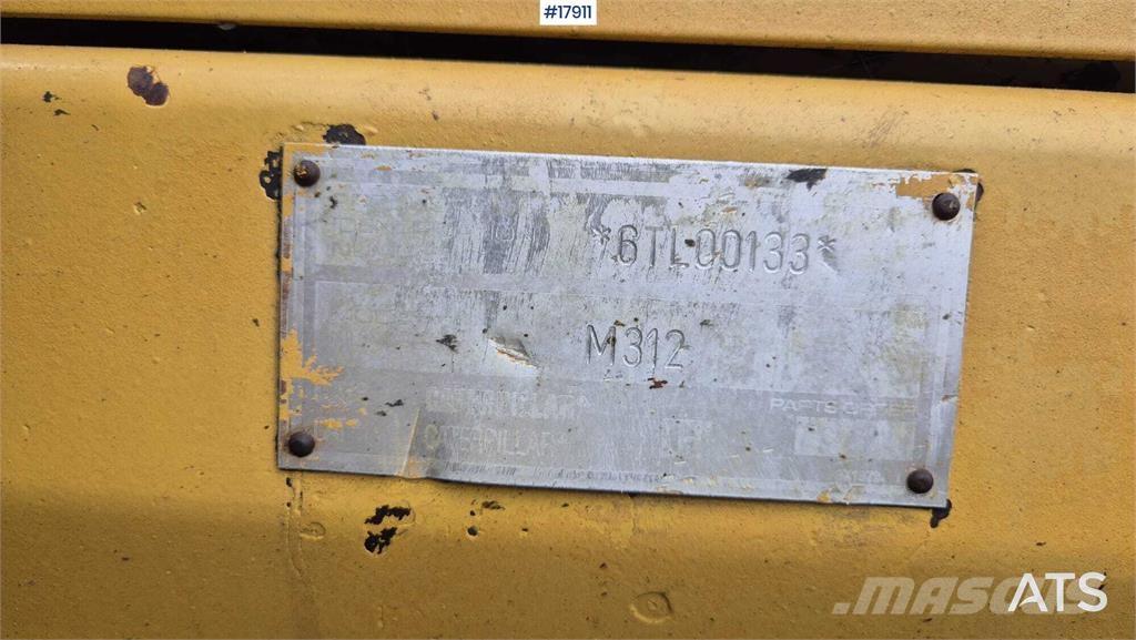 CAT M312 Gumikerekes kotrók