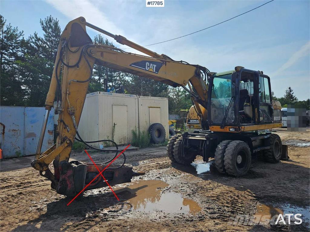 CAT M313 C Gumikerekes kotrók