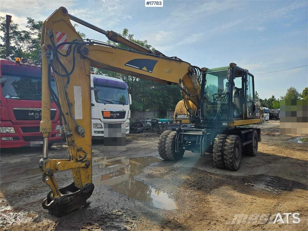 CAT M315C Gumikerekes kotrók