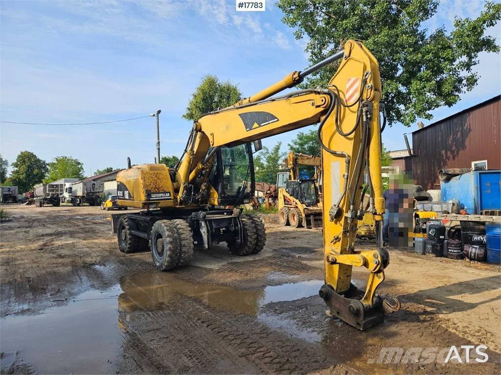 CAT M315C Gumikerekes kotrók