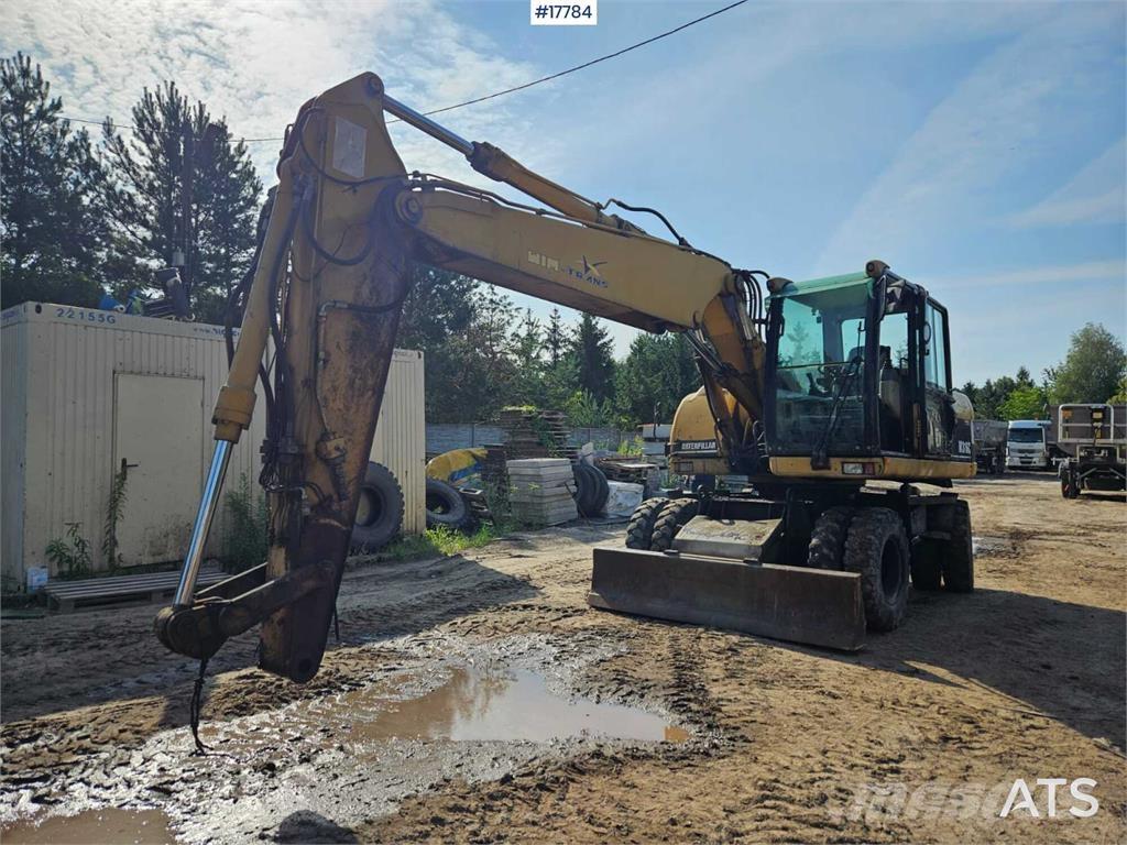 CAT M316C Gumikerekes kotrók