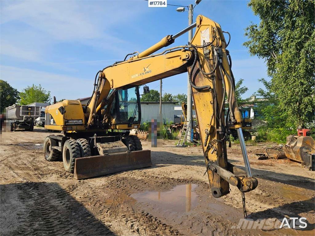 CAT M316C Gumikerekes kotrók