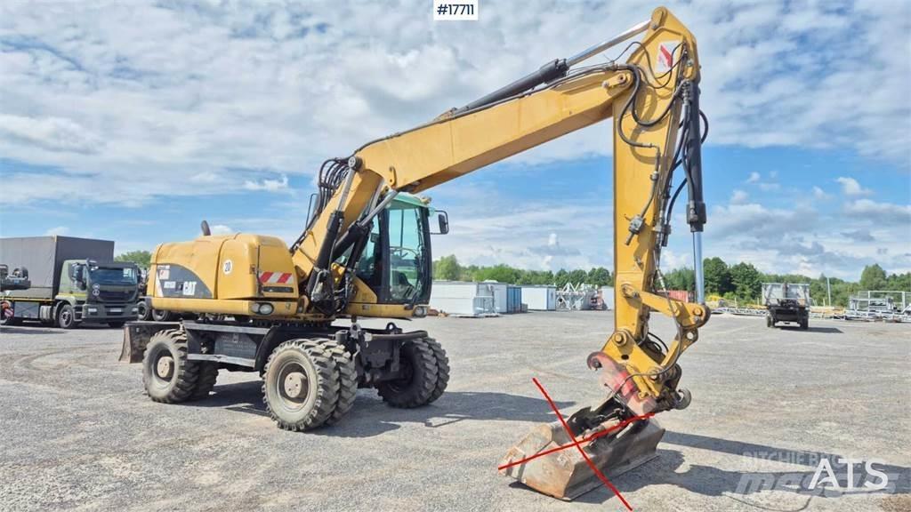 CAT M316D Gumikerekes kotrók