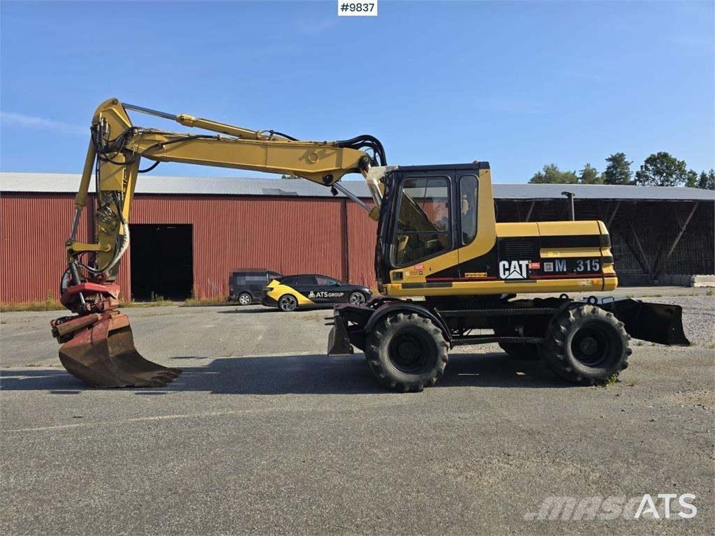 CAT M315 Gumikerekes kotrók