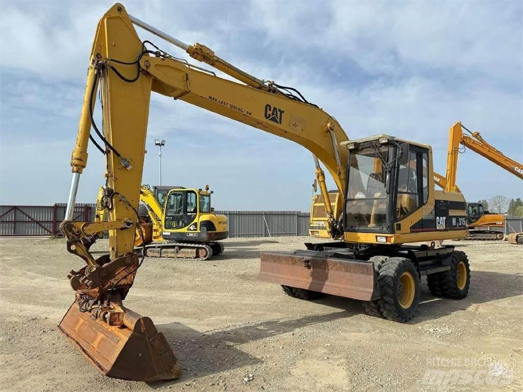 CAT M 315 Gumikerekes kotrók
