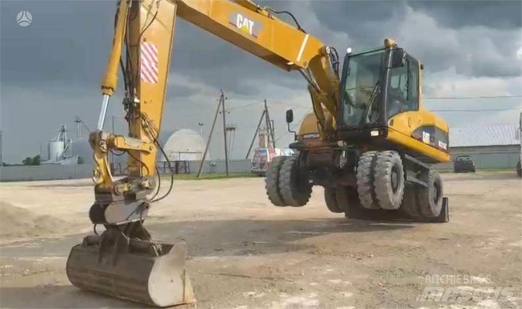 CAT M315C Gumikerekes kotrók